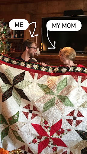 Matt and his mom Kaye holding a quilt